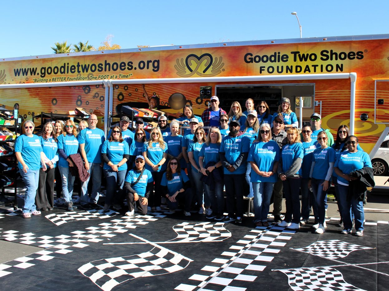 NNSS volunteers stand outside a show trailer.