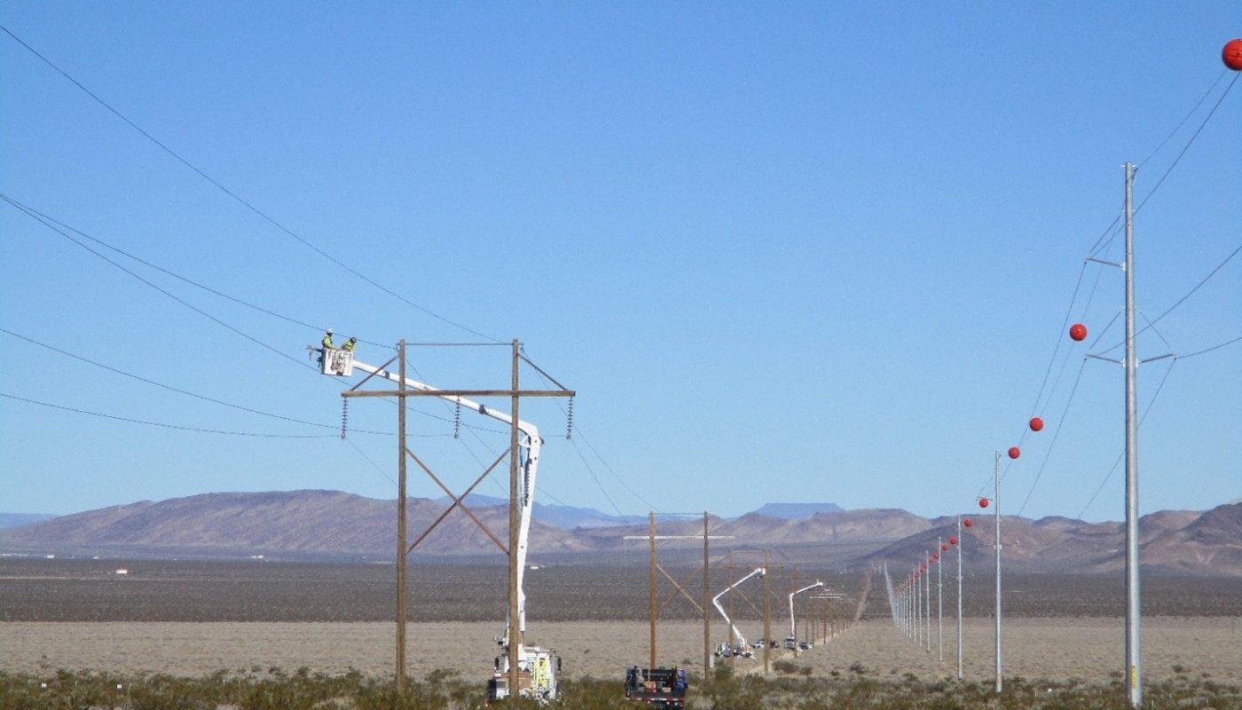The Site's previous 1960s power transmission system and the new power transmission system in the Nevada desert.