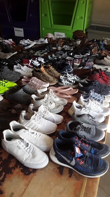 Dozens of pairs of shoes prepared for donation.