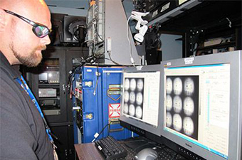 A man studies 9-frame camera radiographic images.