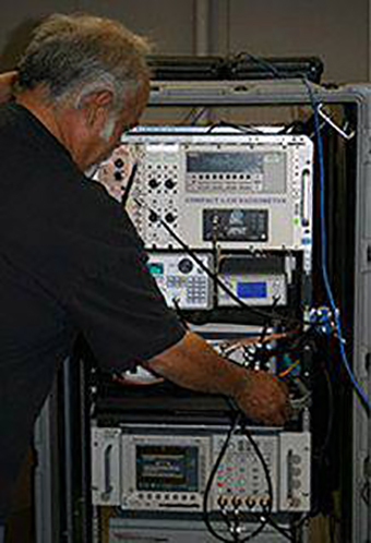 A man adjusting the Compact 6 radiometry system