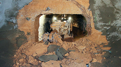 Alpine miner breaks through the final dirt wall