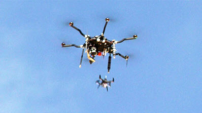 large drone dropping small drone