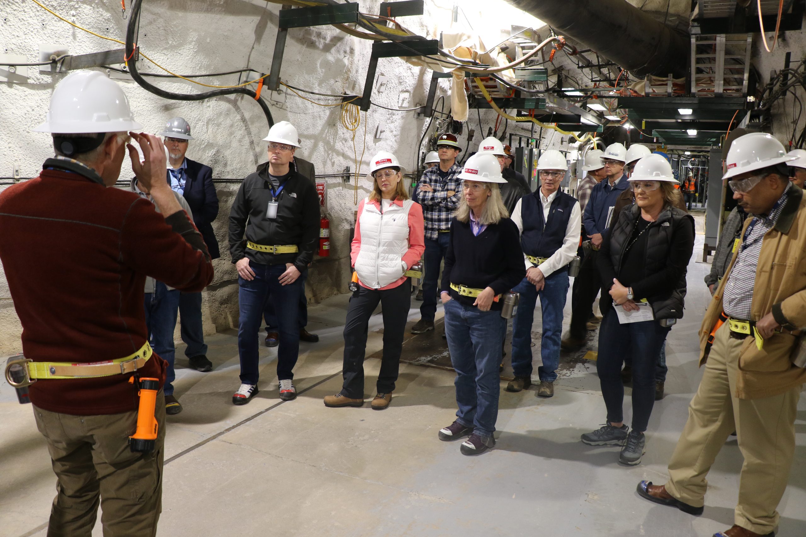 Administrator Jill Hruby and other visitors in hard hats while visiting the NNSS