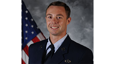 headshot of Brian Kraus in Air Force uniform in front of American flag