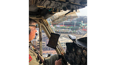 Gentleman in helicopter flying over Boston