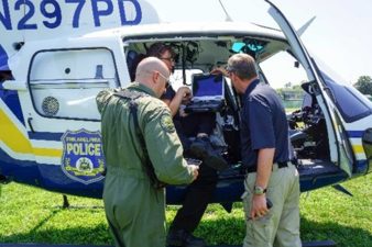 NNSS CTOS Manager Dave Pasquale (right) prepares for aerial operations with the Philadelphia Police Department.