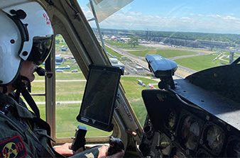 pilot inside helicopter over looking Indianapolis 500 track