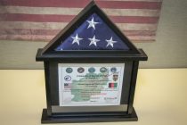 The presentation box encasing the flag and certificate.
