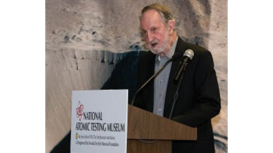 Troy Wade standing at a podium