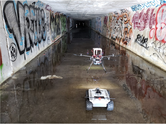 The OKSI rover and hexacopter shown at the entrance of the Irvine tunnel.