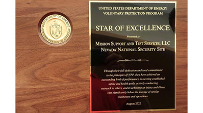a closeup of the Star of Excellence plaque