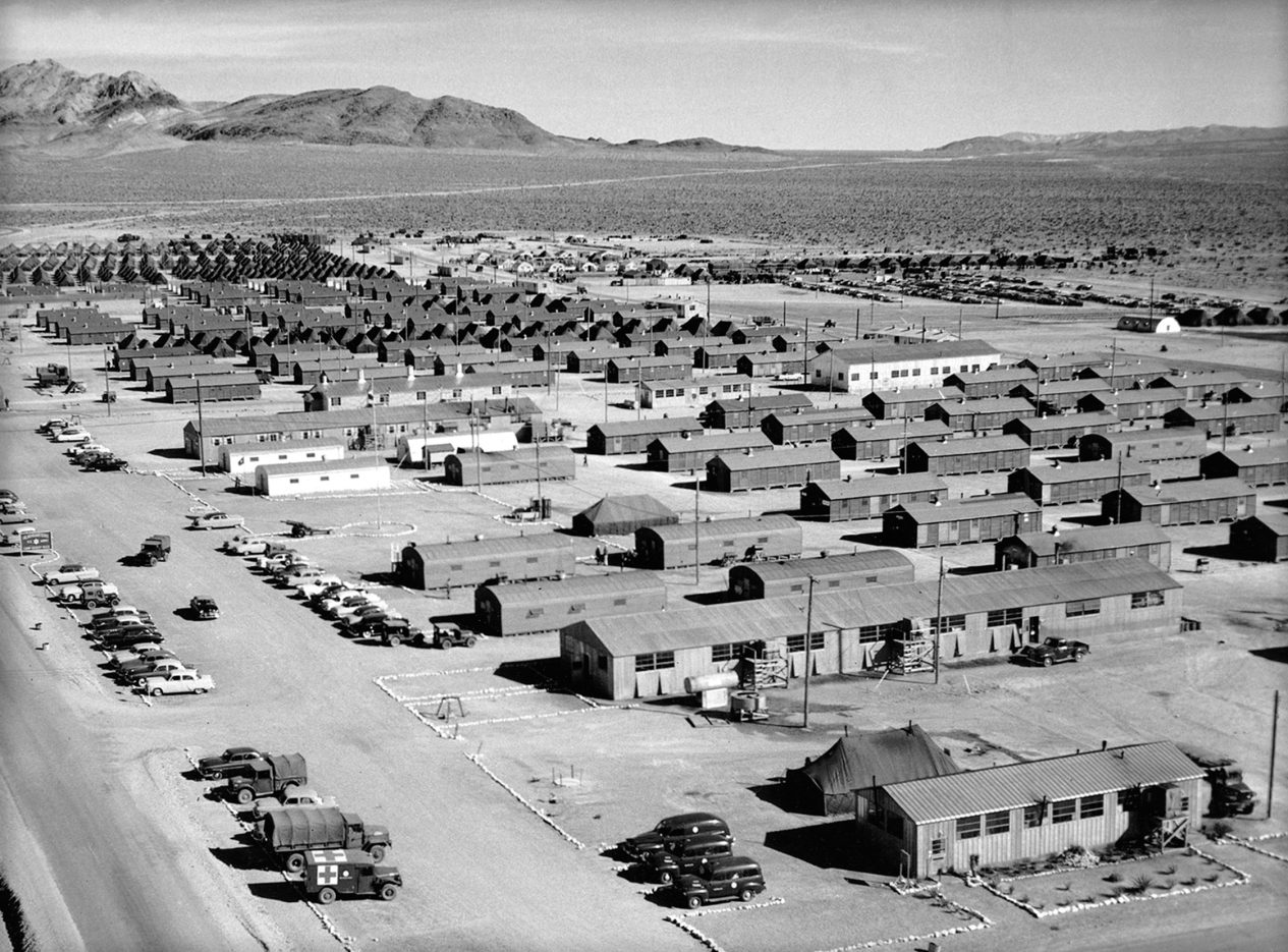 black and white photo of Camp Desert Rock showing buildings and vehicles