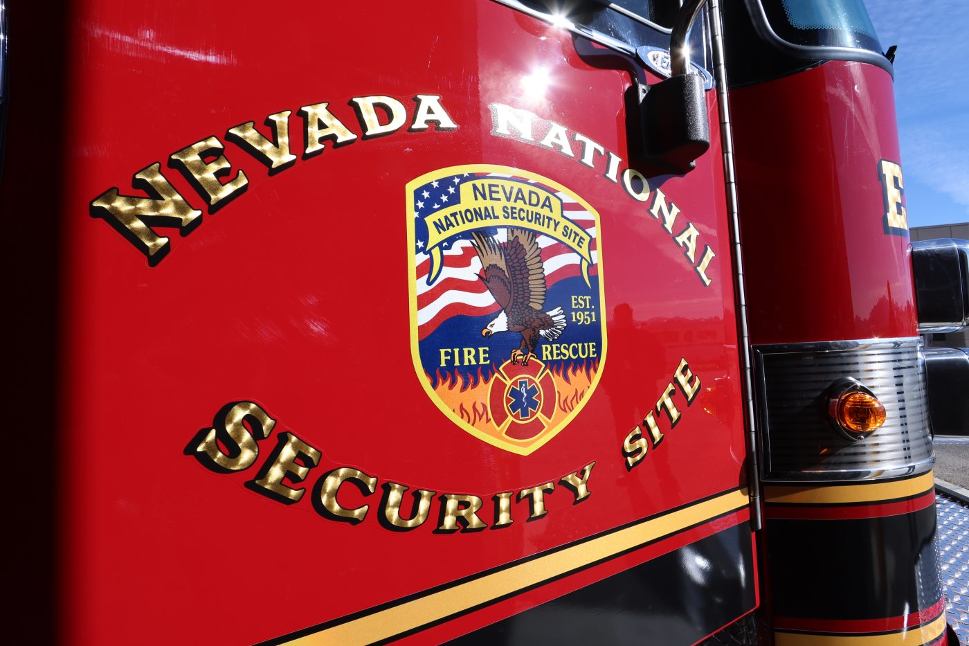 side of fire truck with emblem and Nevada National Security Site around it