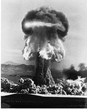Black and white photo of mushroom cloud from a nuclear test