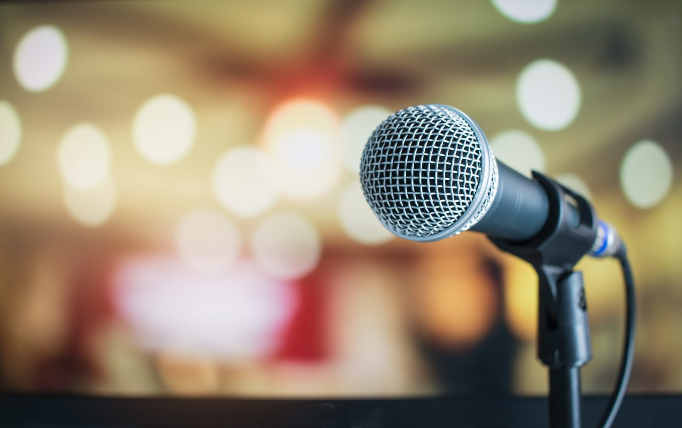 microphone with lights blurred in the background