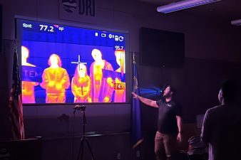 A presenter shows images from a thermal camera.