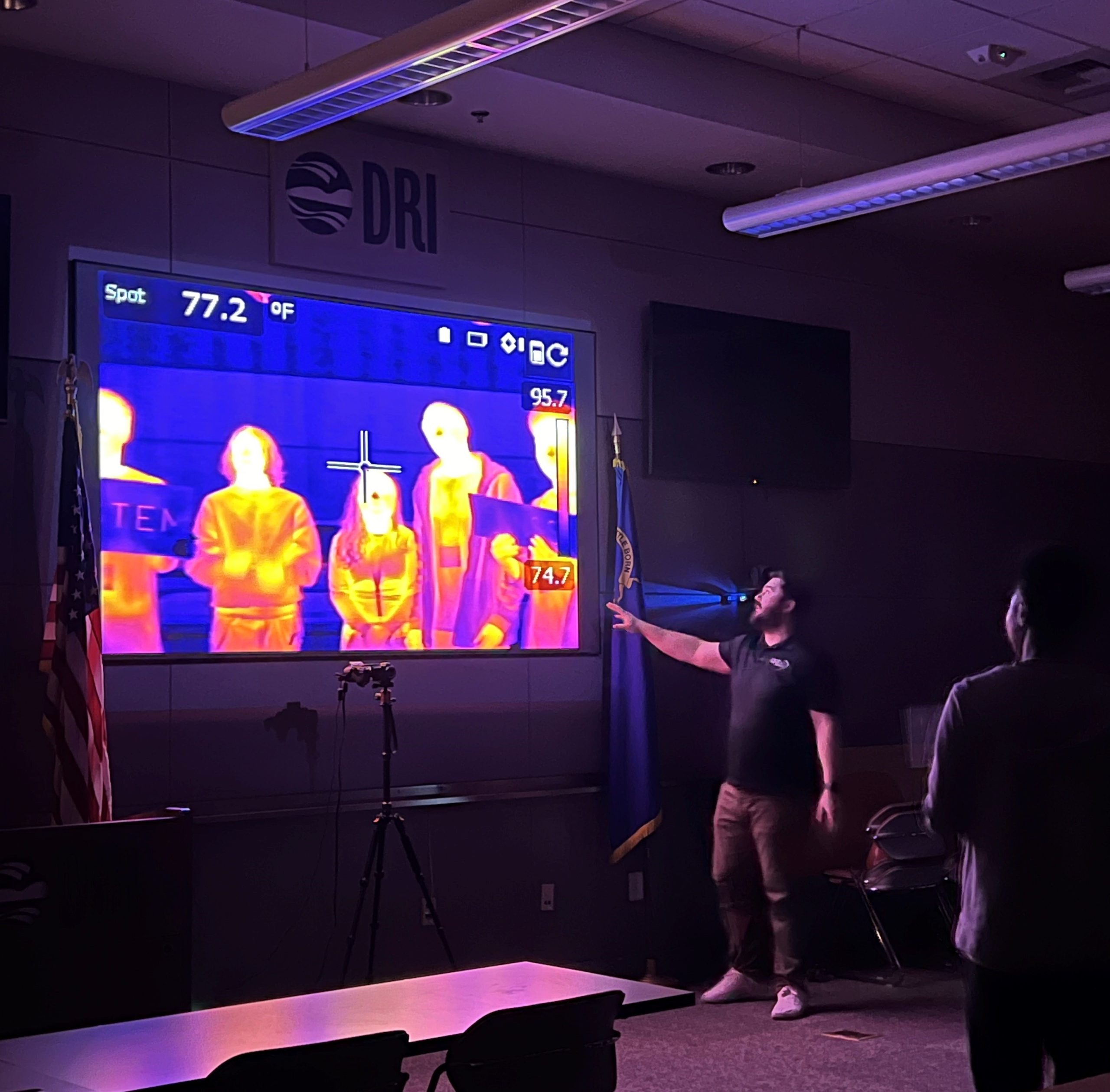 A presenter shows images from a thermal camera.