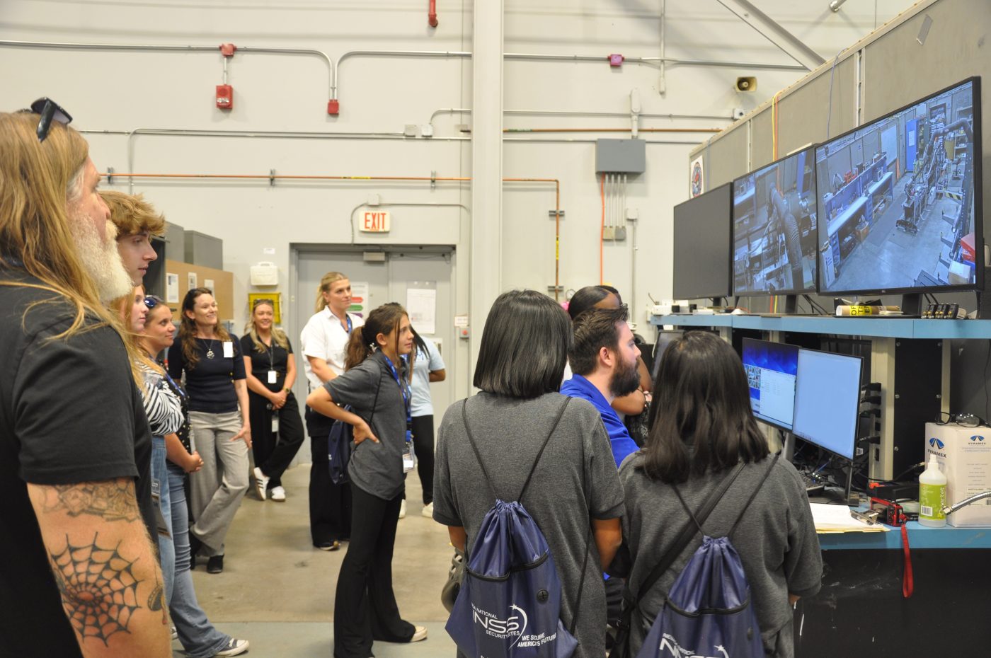 Students watch a computer demonstration.