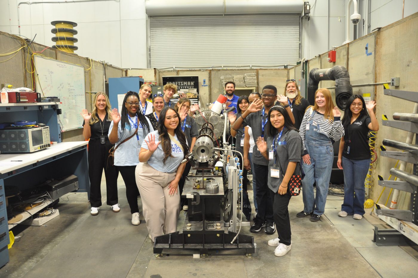 Nevada Flight Crew students wave by a gas gun.