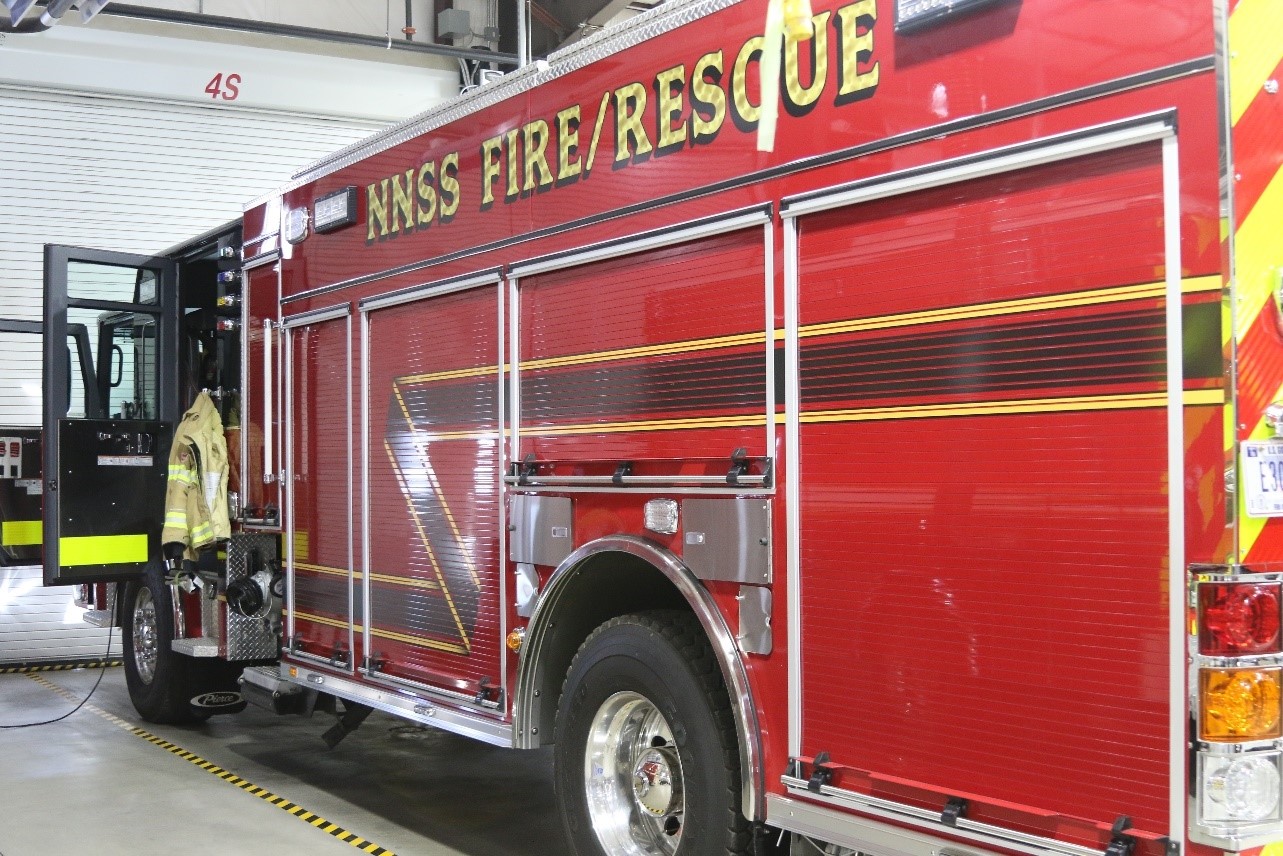 A Type 1 fire engine marked inside a station.