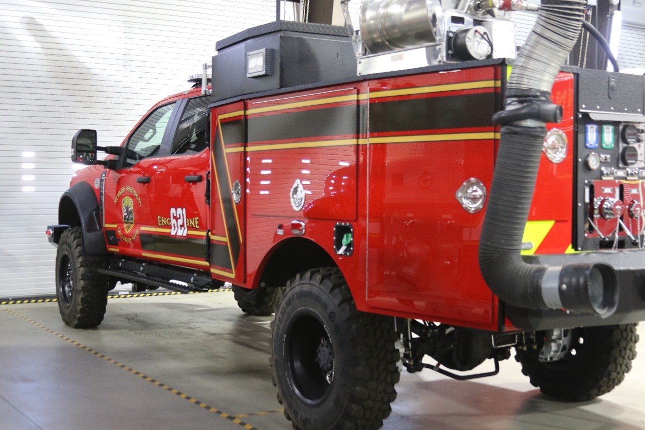 A Type 6 fire vehicle marked inside a station.