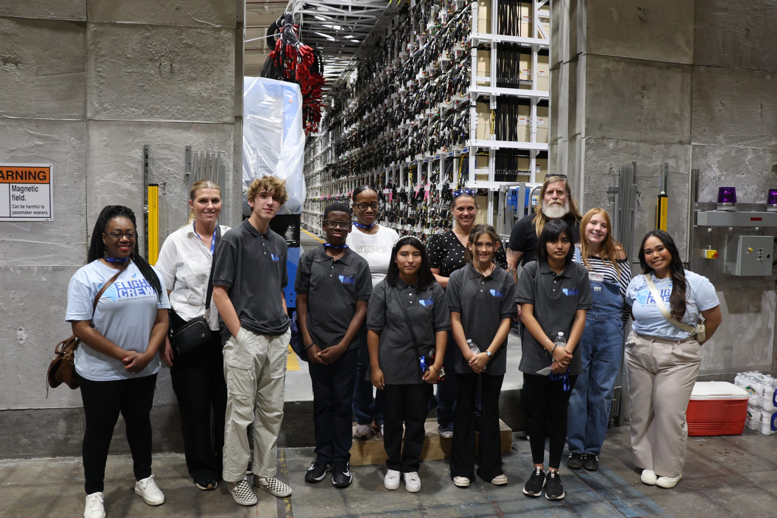 Students stand in front of the NNSS Integrated Test Stand.