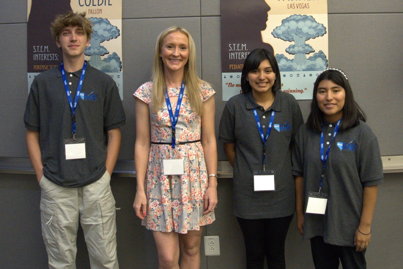 A NNSS employee with three Nevada Flight Crew students.