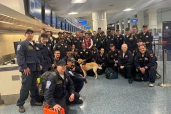 Members of Nevada Task Force 1 gather in the airport.