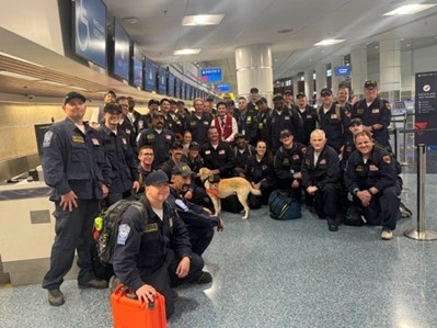 Members of Nevada Task Force 1 gather in the airport.