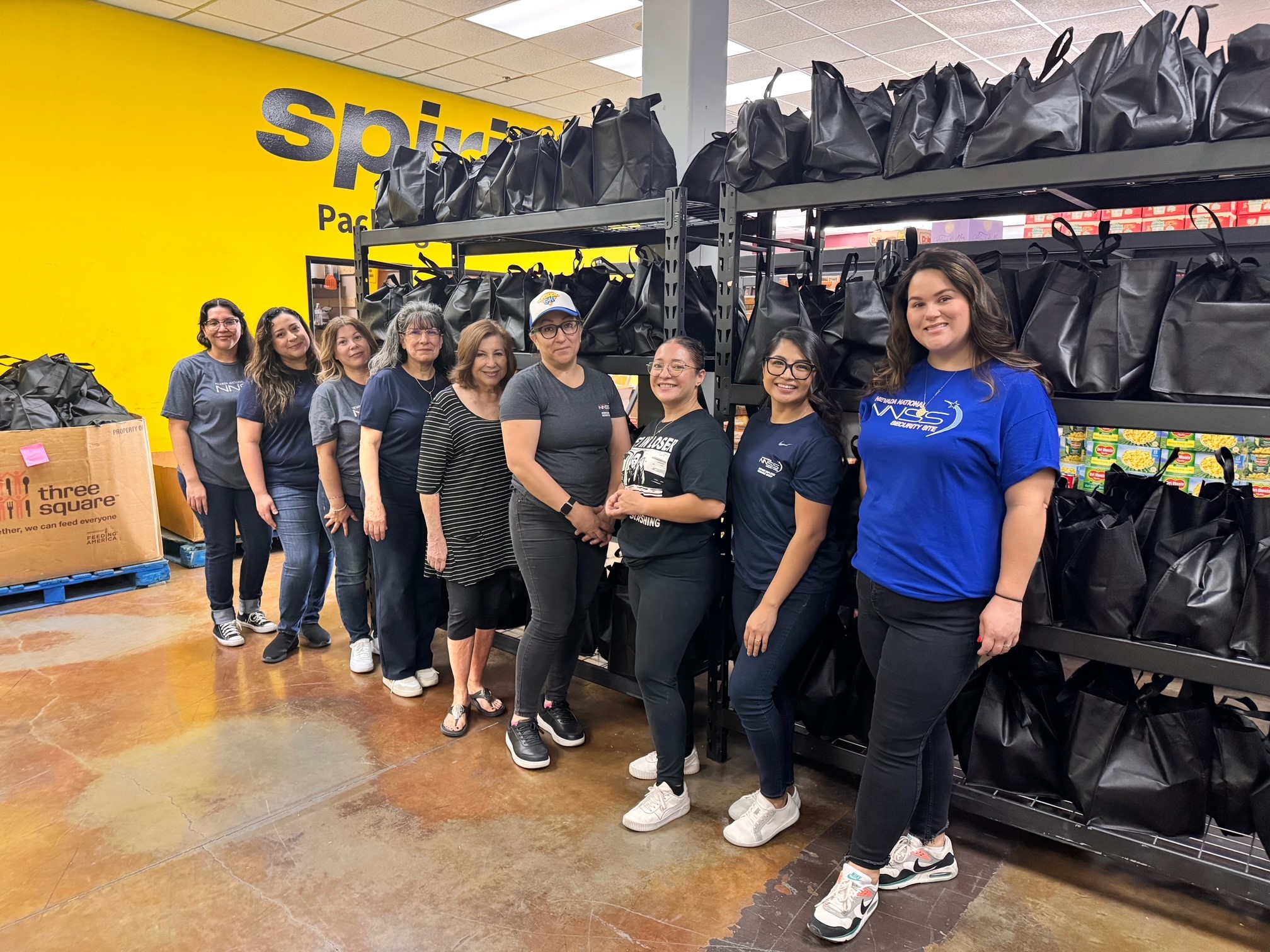 group photo at Project 150 warehouse