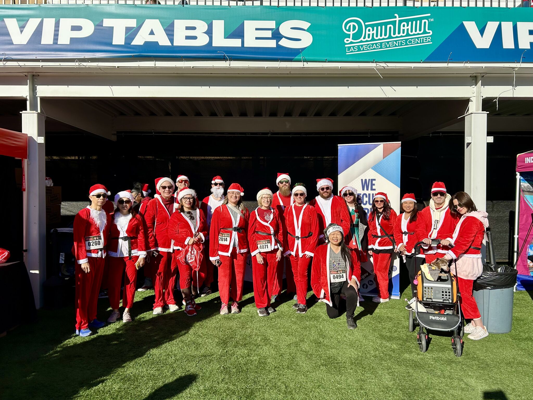 Employees wearing red and white Santa suits.