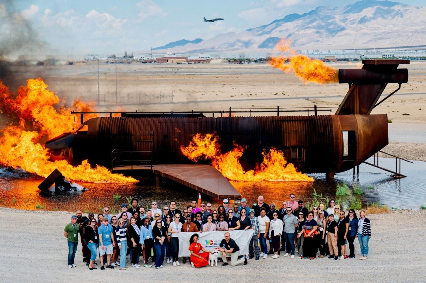 group of 20+people standing in front of a demo